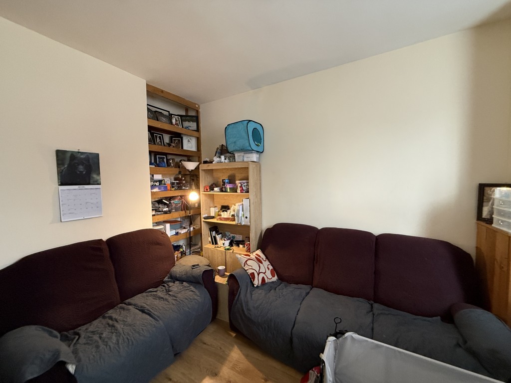 Lot: 111 - FREEHOLD HOUSE FOR INVESTMENT - Living room with tenants furniture
